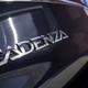 A photo of the Cadenza name badge on the back of a Kia.